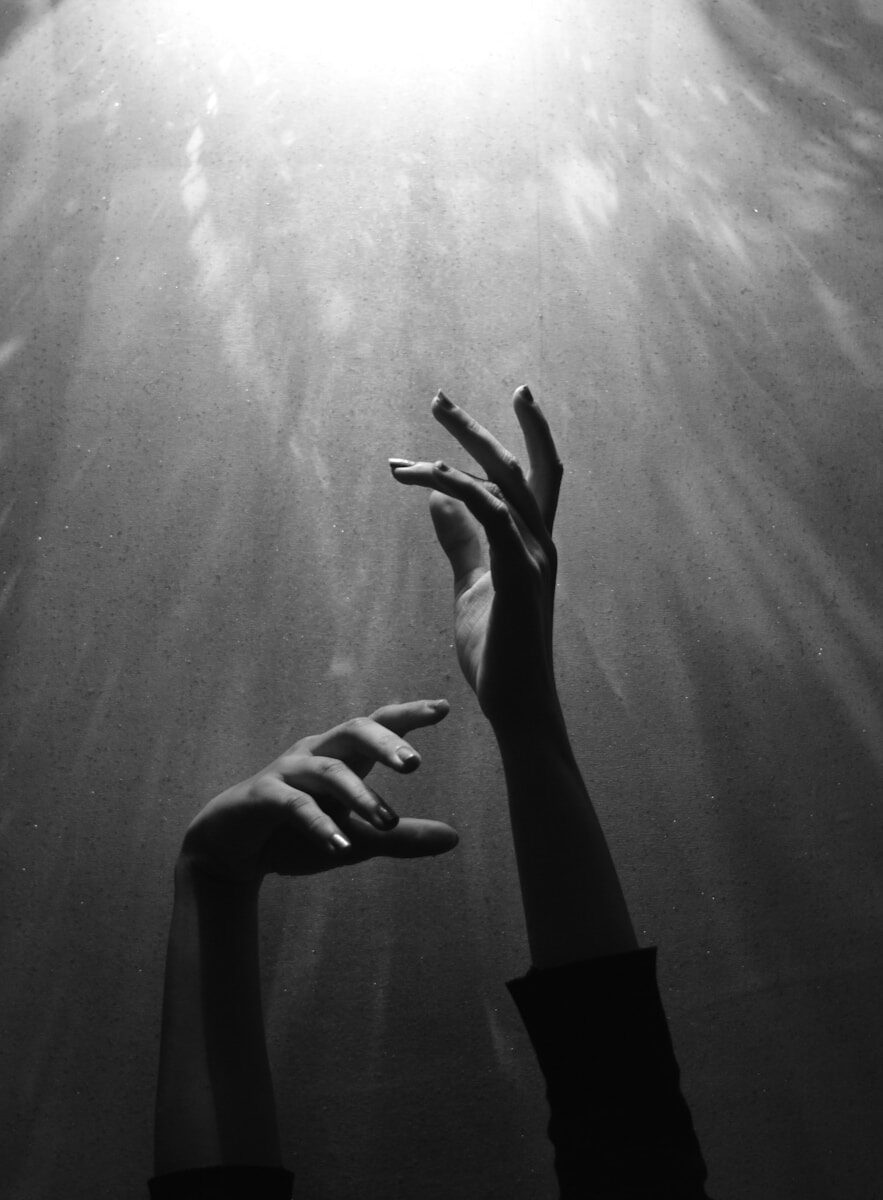 person raising both hands